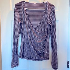 Lululemon long sleeved shirt with crossover detail.